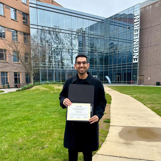 Ashish Hingle holds an award from the 2024 ACM SIGCSE Technical Conference Student Research Competition.